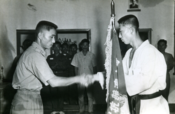 Shaking hands with Master Woo Jong Lim after winning 1st Korean Tae Kwon Do Champion in Black Belt Division in 1962