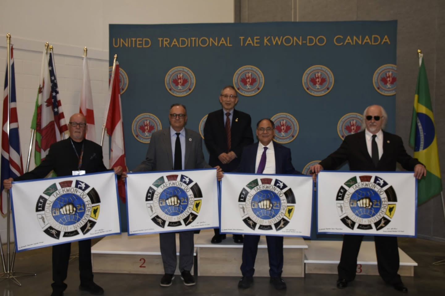 2026 World Cup - GM CK Choi presented ITF Recognition Plaque No. 5 Banners to GM David Oliver, GM Darin Gibson, GM Tom Thurston, and GM Colin Nonomura as Designated Stewards of Traditional Tae Kwon Do